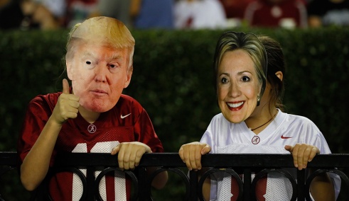 TUSCALOOSA, AL - OCTOBER 01: Two fans are seen wearing masks of 2016 presidential candidates Donald Trump and Hillary Clinton during the game between the Alabama Crimson Tide and the Kentucky Wildcats at Bryant-Denny Stadium on October 1, 2016 in Tuscaloosa, Alabama. (Photo by Kevin C. Cox/Getty Images)